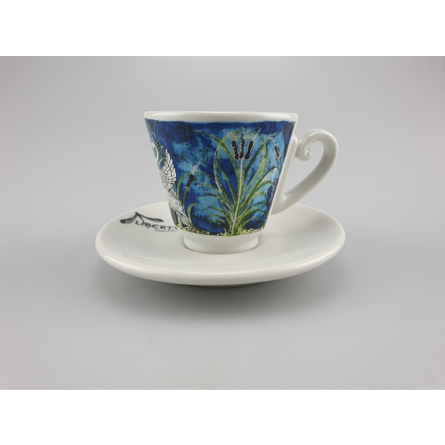 Liberty espresso cup in blue with a fine bird and plant pattern, placed on a matching saucer, uniting nature and art.