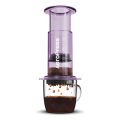 AeroPress Coffee Maker Clear Purple brewing into coffee cup
