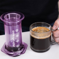 AeroPress Clear Purple infusing coffee in the transparent chamber