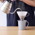 Hario heat retention mug grey with V60 dripper and gooseneck kettle during brewing
