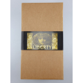 Packaging of the Liberty coffee cup set with gold Art Nouveau graphic, emphasising the exclusivity and artistic value of the contents.