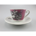 Pink Liberty coffee cup with mythological print design, served on a simple white saucer, symbolising classic elegance