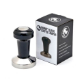 Tamper Rhino Pro Noir avec emballage, poignée ergonomique et base en acier inoxydable.


