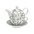 Set de thé élégant en porcelaine avec motif de feuilles, comprenant une théière et une tasse sur une sous-tasse, idéal pour une dégustation de thé stylée.

