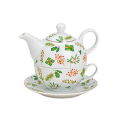 Théière en porcelaine avec tasse et soucoupe assorties, décorée d'un motif floral de Noël, idéale pour les occasions festives.

