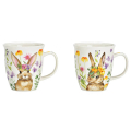 Two porcelain mugs Wiesenhasen with colourful rabbit designs in pink and yellow flower wreaths side by side